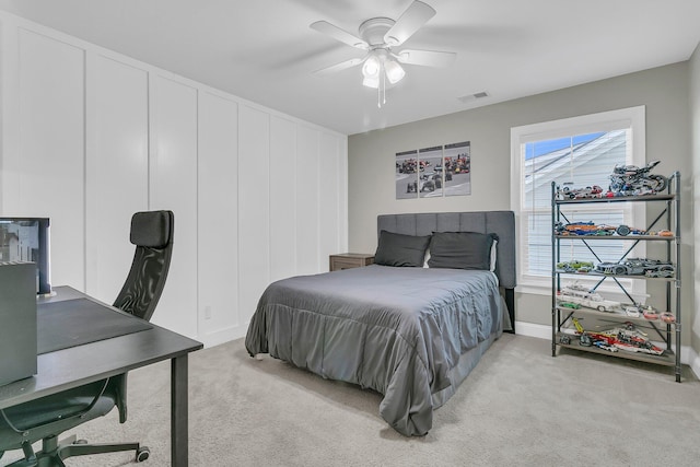 bedroom with light carpet and ceiling fan