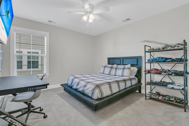 carpeted bedroom featuring ceiling fan