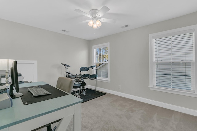 office space with carpet floors and ceiling fan