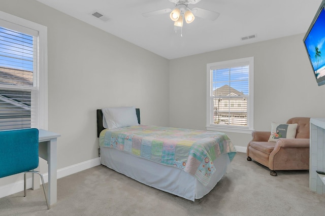 carpeted bedroom featuring ceiling fan