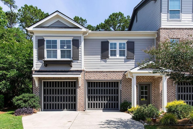 225 Slipper Shell Ct, Mount Pleasant, SC 29464 - view of front of house with brick siding, a garage, and driveway