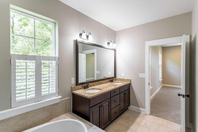 225 Slipper Shell Ct, Mount Pleasant, SC 29464 - full bath with healthy amount of natural light, double vanity, tile patterned flooring, and a bath