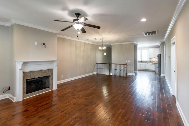 225 Slipper Shell Ct, Mount Pleasant, SC 29464 - unfurnished living room with ceiling fan, dark wood finished floors, a fireplace, recessed lighting, and crown molding