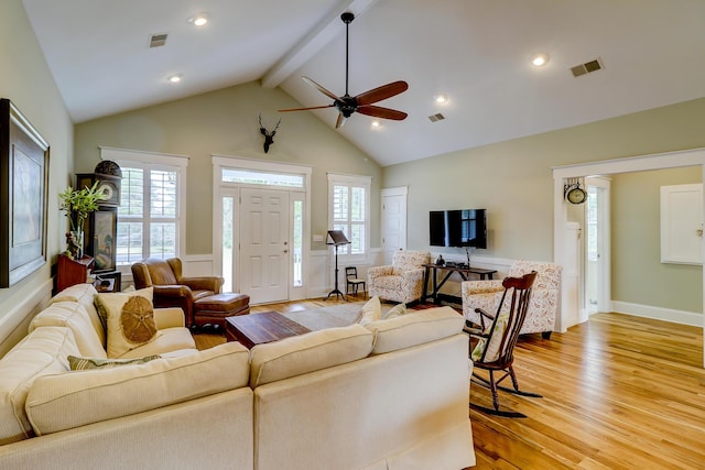 living area with plenty of natural light, light wood-style floors, and visible vents