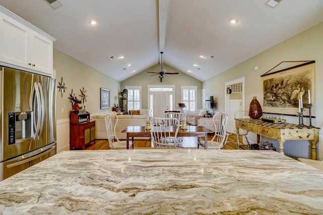 interior space with recessed lighting, visible vents, lofted ceiling, and wood finished floors