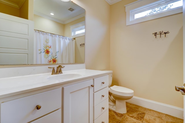 full bathroom with vanity, toilet, a healthy amount of sunlight, and baseboards