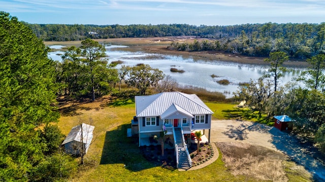 bird's eye view featuring a water view and a view of trees