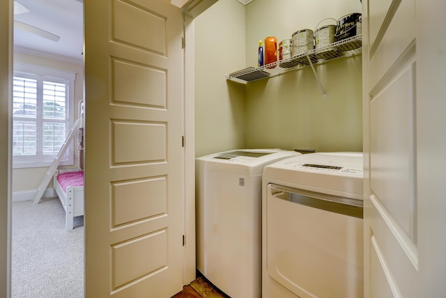 laundry area with baseboards, carpet, laundry area, and washing machine and clothes dryer