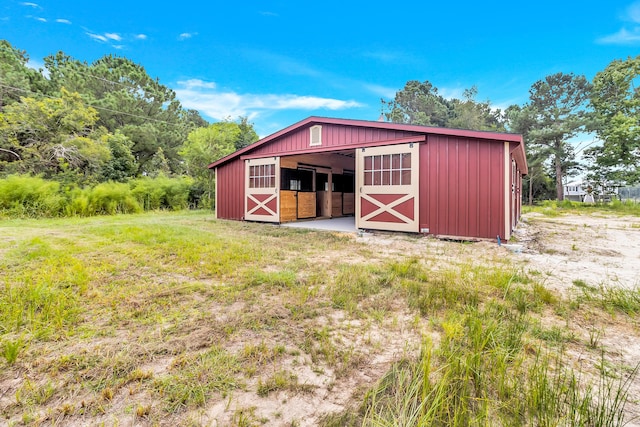 view of outbuilding featuring an outdoor structure and an exterior structure