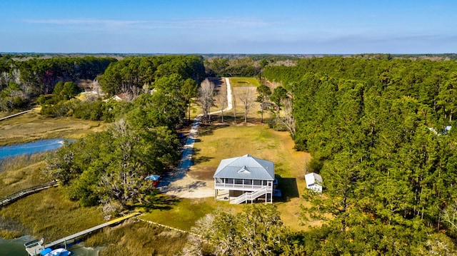 aerial view featuring a wooded view