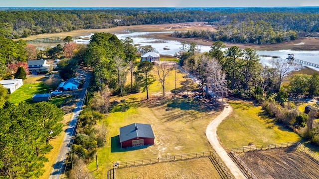 aerial view featuring a view of trees and a water view