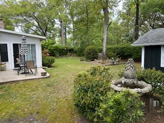 206 Brailsford Rd, Summerville, SC 29485 - view of yard with an outdoor structure and a patio