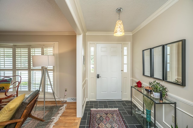 206 Brailsford Rd, Summerville, SC 29485 - foyer featuring baseboards, visible vents, a textured ceiling, and crown molding