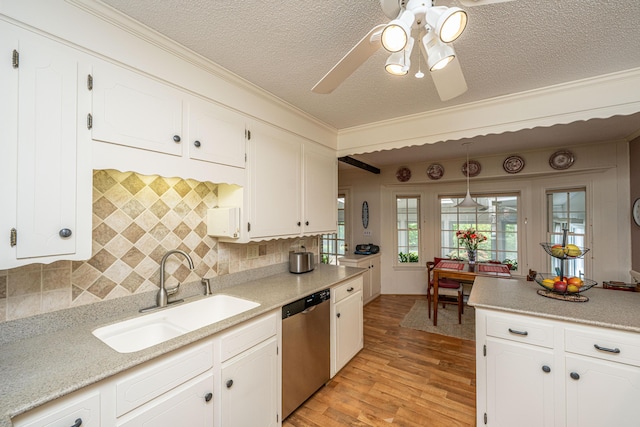 206 Brailsford Rd, Summerville, SC 29485 - kitchen with white cabinets, stainless steel dishwasher, a sink, light wood-style flooring, and a textured ceiling