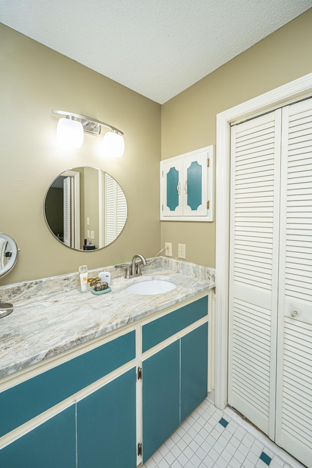 206 Brailsford Rd, Summerville, SC 29485 - bathroom featuring vanity, tile patterned floors, and a textured ceiling
