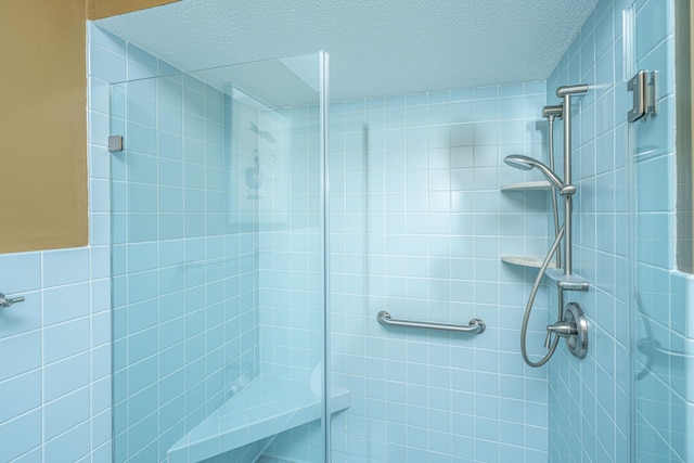 206 Brailsford Rd, Summerville, SC 29485 - bathroom featuring a textured ceiling and a tile shower