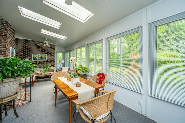 206 Brailsford Rd, Summerville, SC 29485 - sunroom with brick wall, carpet, and vaulted ceiling with skylight