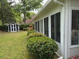 206 Brailsford Rd, Summerville, SC 29485 - view of property exterior with an outbuilding, a lawn, and a storage unit