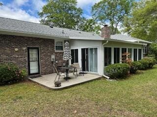 206 Brailsford Rd, Summerville, SC 29485 - back of property with a patio, a chimney, and a yard