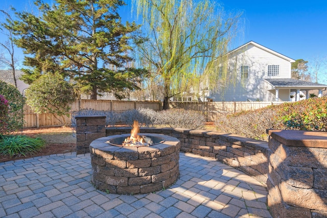 view of patio with a fire pit and a fenced backyard