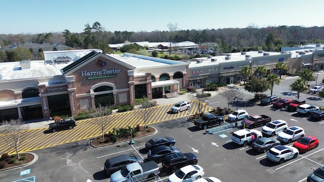 view of building exterior featuring uncovered parking