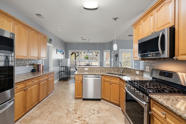 kitchen featuring a sink, plenty of natural light, visible vents, and stainless steel appliances