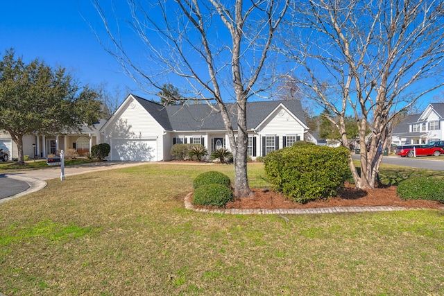 ranch-style home featuring concrete driveway, a garage, and a front yard