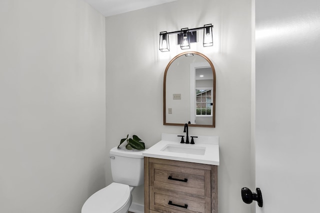 bathroom with toilet and vanity