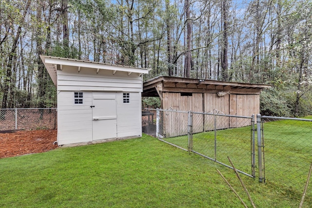 view of shed featuring a gate and fence