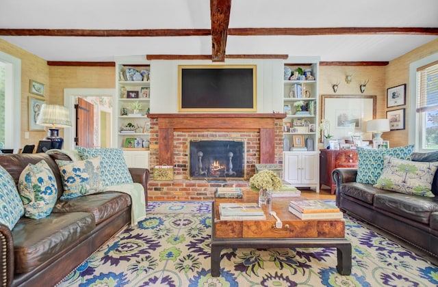 481 Cantey Ln, Camden, SC 29020 - living room featuring beamed ceiling, a brick fireplace, and built in shelves