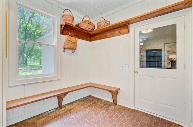 481 Cantey Ln, Camden, SC 29020 - mudroom with brick flooring, healthy amount of natural light, ornamental molding, and wood walls
