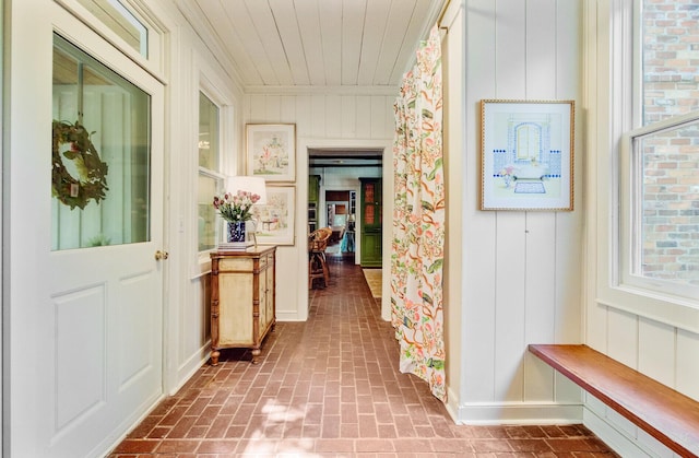 481 Cantey Ln, Camden, SC 29020 - hallway with brick patterned flooring, wood ceiling, and wood walls