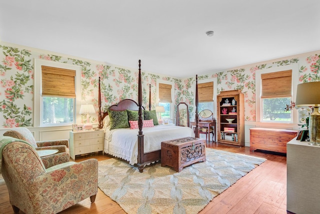 481 Cantey Ln, Camden, SC 29020 - bedroom with wallpapered walls and hardwood / wood-style floors