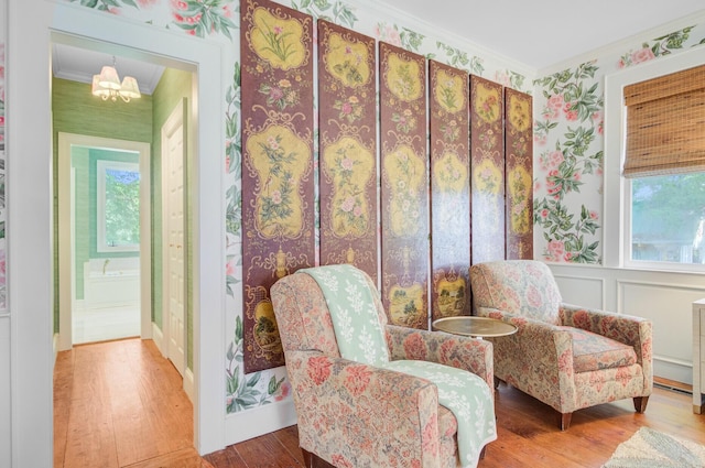 481 Cantey Ln, Camden, SC 29020 - living area featuring hardwood / wood-style floors, ornamental molding, wallpapered walls, plenty of natural light, and a chandelier