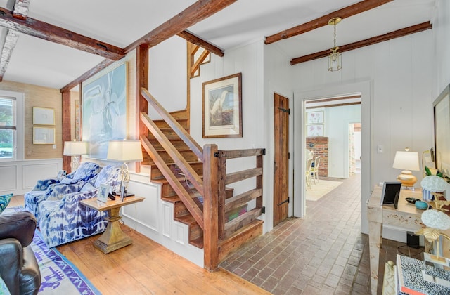 481 Cantey Ln, Camden, SC 29020 - stairway featuring beamed ceiling and a decorative wall