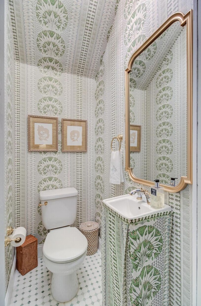 481 Cantey Ln, Camden, SC 29020 - bathroom with wallpapered walls, toilet, and vanity