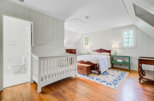 481 Cantey Ln, Camden, SC 29020 - bedroom featuring multiple windows, wood-type flooring, and vaulted ceiling