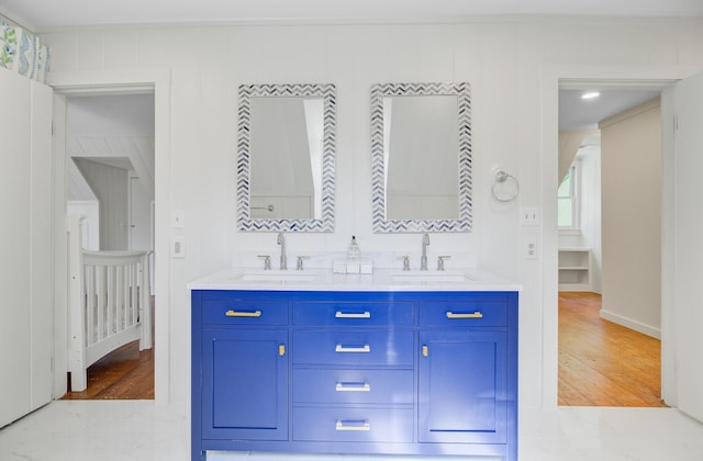 481 Cantey Ln, Camden, SC 29020 - bathroom with wood finished floors, double vanity, and baseboards