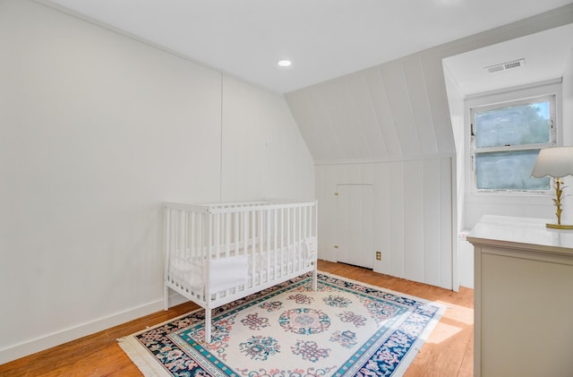 481 Cantey Ln, Camden, SC 29020 - bedroom featuring wood finished floors and a decorative wall