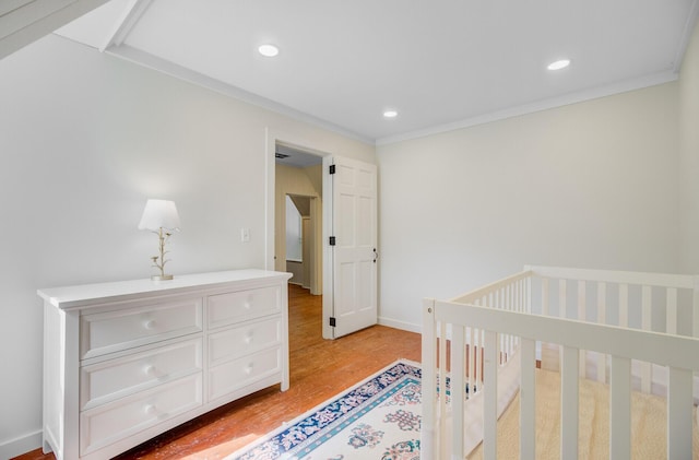 481 Cantey Ln, Camden, SC 29020 - bedroom featuring light wood-style flooring, recessed lighting, ornamental molding, and baseboards