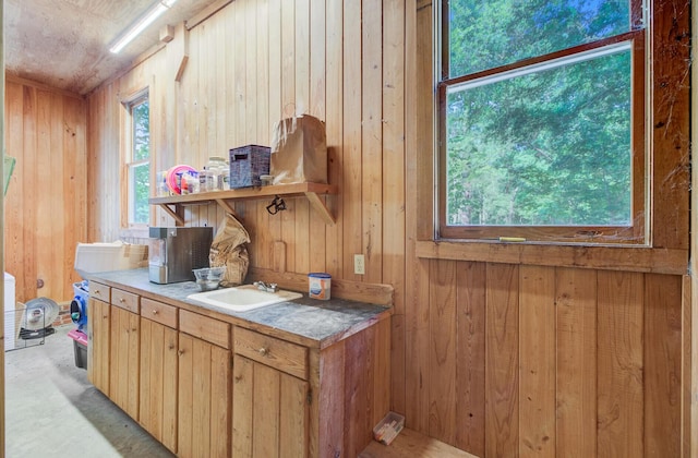481 Cantey Ln, Camden, SC 29020 - kitchen with a sink, wooden walls, and open shelves