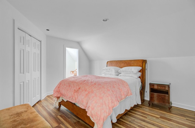 481 Cantey Ln, Camden, SC 29020 - bedroom with lofted ceiling, wood finished floors, a closet, baseboards, and recessed lighting