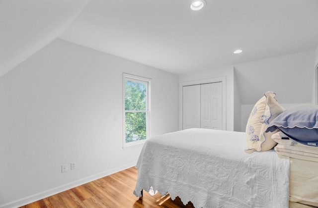 481 Cantey Ln, Camden, SC 29020 - bedroom with wood finished floors, baseboards, a closet, recessed lighting, and vaulted ceiling