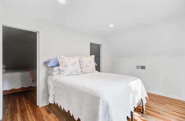 481 Cantey Ln, Camden, SC 29020 - bedroom featuring wood finished floors, baseboards, lofted ceiling, and recessed lighting