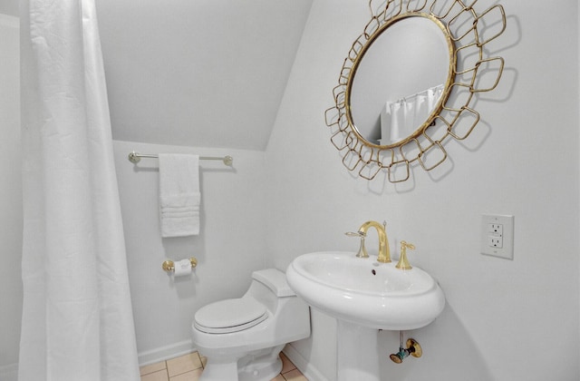 481 Cantey Ln, Camden, SC 29020 - full bathroom featuring toilet, tile patterned floors, baseboards, vaulted ceiling, and a shower with shower curtain