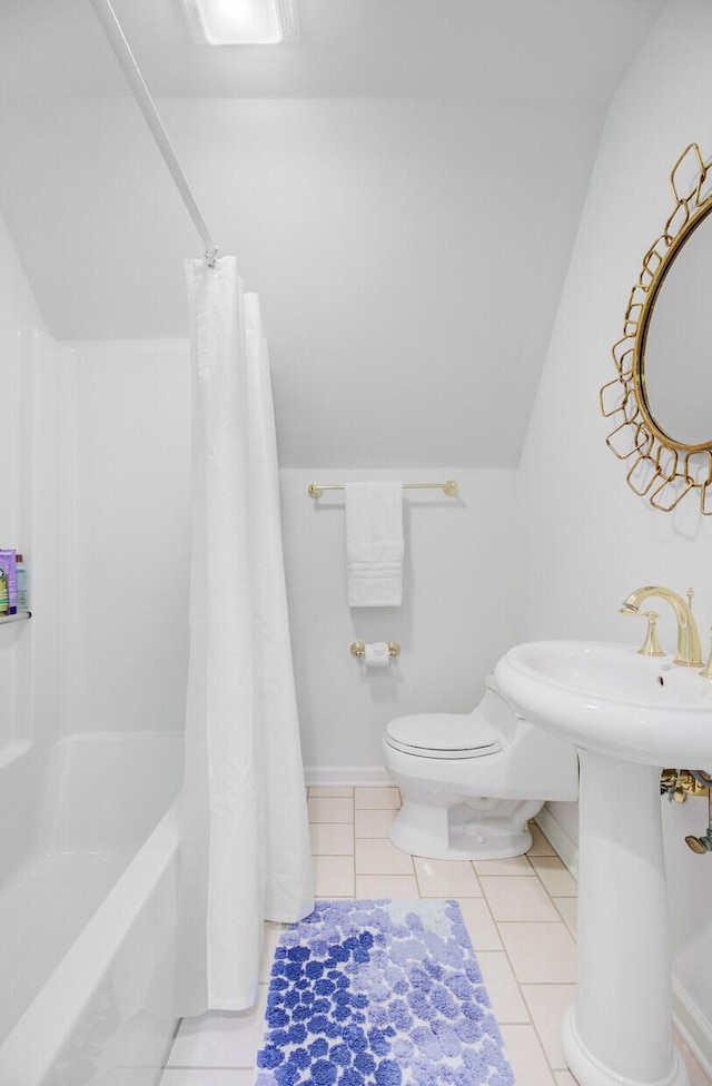 481 Cantey Ln, Camden, SC 29020 - bathroom with toilet, shower / bath combo with shower curtain, lofted ceiling, tile patterned floors, and baseboards