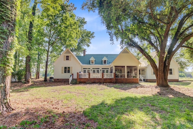 481 Cantey Ln, Camden, SC 29020 - back of property with a sunroom, a yard, crawl space, and a chimney