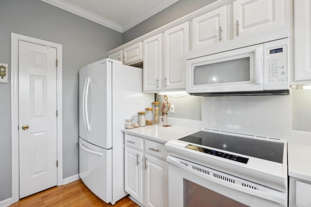 2329 Tall Sail Dr Unit 704D, Charleston, SC 29414 - kitchen featuring white appliances, crown molding, white cabinetry, light countertops, and light wood finished floors