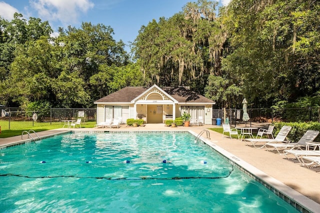 2329 Tall Sail Dr Unit 704D, Charleston, SC 29414 - community pool featuring a patio area and view of scattered trees