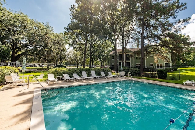2329 Tall Sail Dr Unit 704D, Charleston, SC 29414 - community pool featuring a patio area and view of wooded area